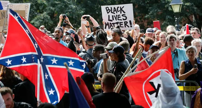 Protesters demonstrate against a KKK rally in Charlottesville, VA, in July 2017. Journalists reporting on white supremacists say they face threats and harassment. (AP/Steve Helber)
