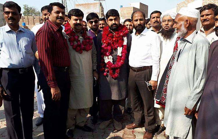 Pakistani journalist Hafiz Husnain Raza (center with garland) was released on bail March 10, 2018. (Hassaan Raza)