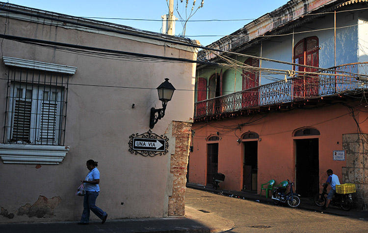 A woman walks in Santo Domingo in 2008. A Dominican court has sentenced a man to 20 years in prison over the murder of a journalist. (AFP/Eitan Abramovich)