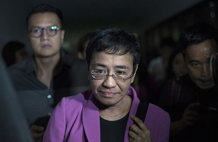 Maria Ressa, the founder of Rappler, arrives at the National Bureau of Investigation headquarters in Manila on January 22, 2018. Ressa says she believes the news website is being harassed because of its critical coverage of the President of the Philippines. (AFP/Noel Celis)