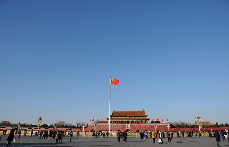 A Chinese flag flutters in Tiananmen Square in Beijing, China in December 2017. Police from Inner Mongolia arrested journalist Zou Guangxiang at his Beijing home on March 28, 2018, according to news reports. (Reuters/ Stringer)