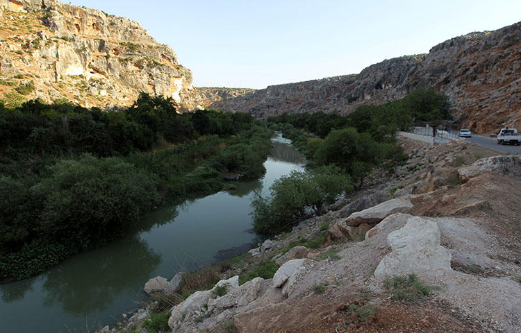 The al-Assi river in the town of Darkush in Syria's Idlib province on July 8, 2016. A Syrian militant group detained photographers Ahmad al-Akhras and Rami al-Ruslan as they were taking pictures of a water spring east of Darkush. (Reuters/Ammar Abdullah)