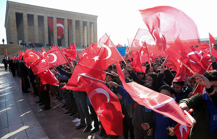 Children wave the Turkish flag outside the mausoleum of the founder of the Turkish Republic Mustafa Kemal Ataturk, in Ankara on April 23, 2018. A Turkish government minister in December 2017 said that Turkey blocked Wikipedia because it insults Mustafa Kemal Atatürk, the founder of modern Turkey, according to reports. (AFP/Adem Altan)