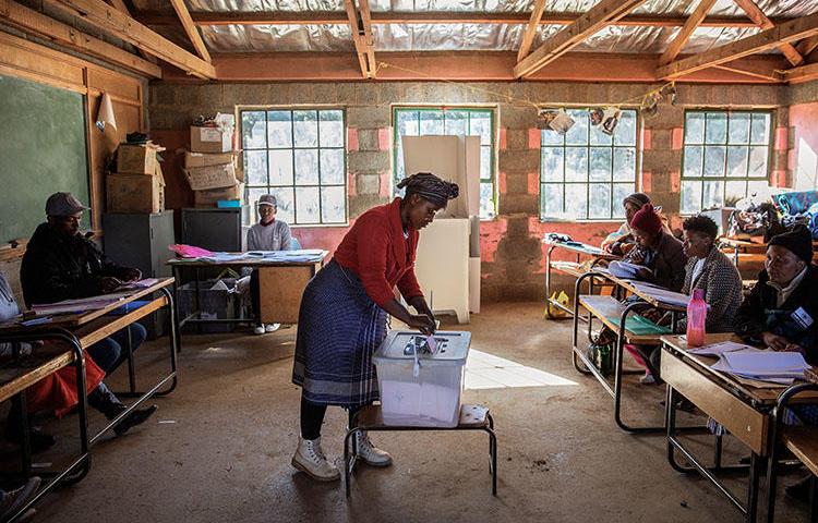 A woman casts her ballot in general elections at a polling station in the village of Nyakosoba, Lesotho, on June 3, 2017. Lesotho's Constitutional Court declared criminal defamation unconstitutional on May 21, 2018. (Gianluigi Guercia/AFP)