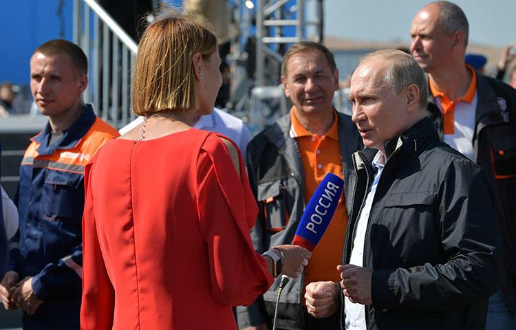 Russian President Vladimir Putin gives an interview at a May 15, 2018, ceremony opening a bridge that will connect the Russian mainland with the Crimean Peninsula. Ukraine authorities accused the director of Russian state news agency RIA Novosti's Kiev office of propaganda supporting the annexing of Crimea. (Sputnik/Alexei Druzhinin/Kremlin via Reuters)