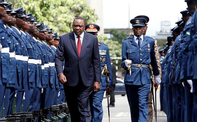Kenyan President Uhuru Kenyatta inspects an honor guard in Nairobi on May 2, 2018. CPJ calls on Kenyatta not to sign a cybercrime bill passed by Parliament. (Reuters/Thomas Mukoya)