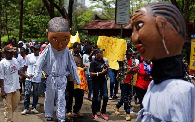 Protesters march against government corruption in Nairobi on the 53rd anniversary of Kenya's independence on December 12, 2016. Kenyan authorities arrested blogger Cyprian Nyakundi on May 14, 2018, after his posts on alleged official corruption, and released him three days later. (AP/Ben Curtis)