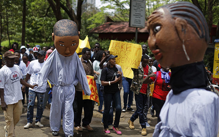 Protesters march against government corruption in Nairobi on the 53rd anniversary of Kenya's independence on December 12, 2016. Kenyan authorities arrested blogger Cyprian Nyakundi on May 14, 2018, after his posts on alleged official corruption, and released him three days later. (AP/Ben Curtis)