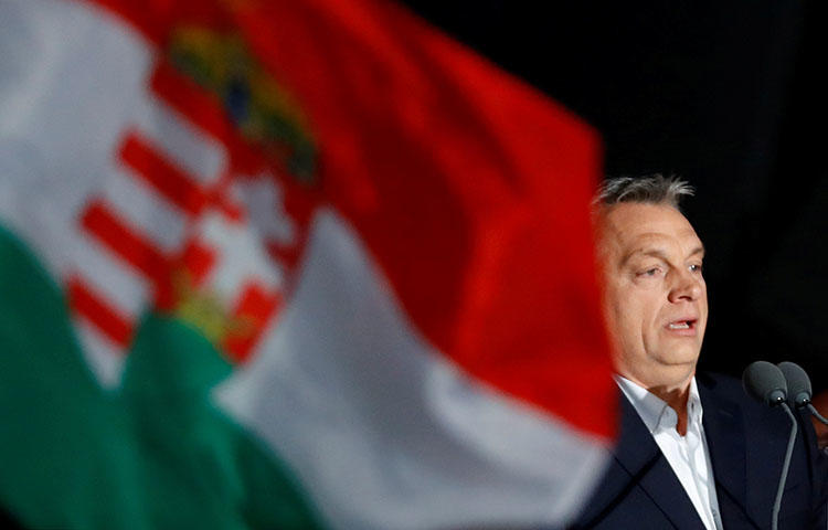 Hungarian Prime Minister Viktor Orbán addresses supporters in Budapest after partial results of the country's parliamentary elections are announced on April 8, 2018. (Reuters/Leonhard Foeger)