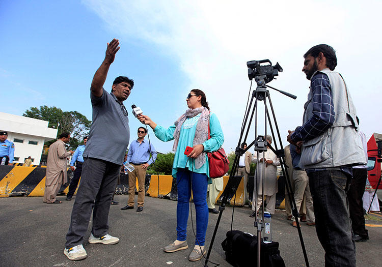 Journalists work during a demonstration on May 3, 2018, to mark World Press Freedom Day in Islamabad, Pakistan. (Faisal Mahmood/Reuters)