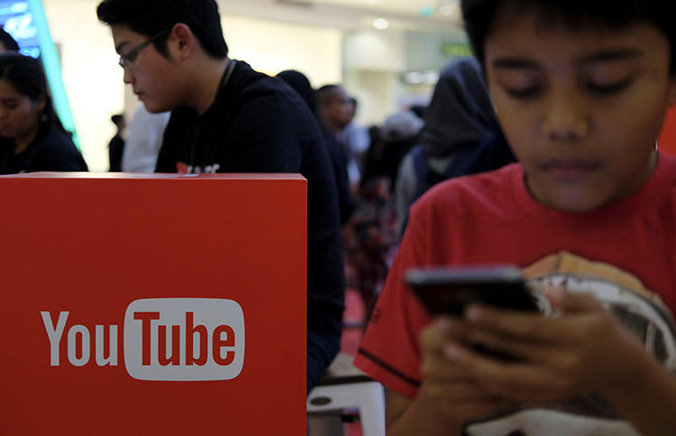 People attend the YouTube Fanfest in Jakarta, Indonesia, in October 2016. Google released its first YouTube-specific transparency report in May. (Reuters/Beawiharta)
