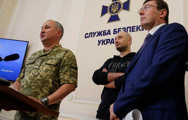 Vasily Gritsak, head of the Ukrainian Security Service, left, speaks to the media as Russian journalist Arkady Babchenko, center, and Ukrainian Prosecutor General Yuriy Lutsenko attend a news conference at the Ukrainian Security Service on May 30, 2018. Babchenko turned up at a news conference in the Ukrainian capital Wednesday less than 24 hours after police reported he had been shot and killed in Kiev. (AP/Efrem Lukatsky)