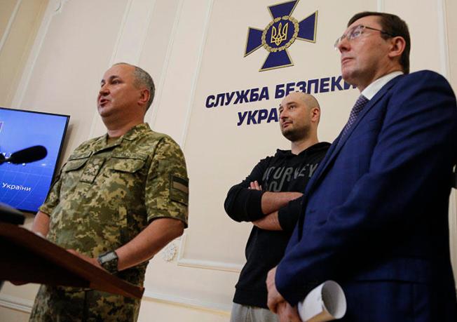 Vasily Gritsak, head of the Ukrainian Security Service, left, speaks to the media as Russian journalist Arkady Babchenko, center, and Ukrainian Prosecutor General Yuriy Lutsenko attend a news conference at the Ukrainian Security Service on May 30, 2018. Babchenko turned up at a news conference in the Ukrainian capital Wednesday less than 24 hours after police reported he had been shot and killed in Kiev. (AP/Efrem Lukatsky)