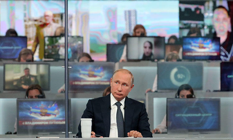 Russian President Vladimir Putin holds his annual televised phone-in with the nation in Moscow on June 7, 2018. Russian journalist Viktor Korb was charged on May 16 by authorities in the town of Omsk, in southwestern Siberia, with terrorism-related offenses. (AFP/Mikhail Klimentyev/Sputnik)