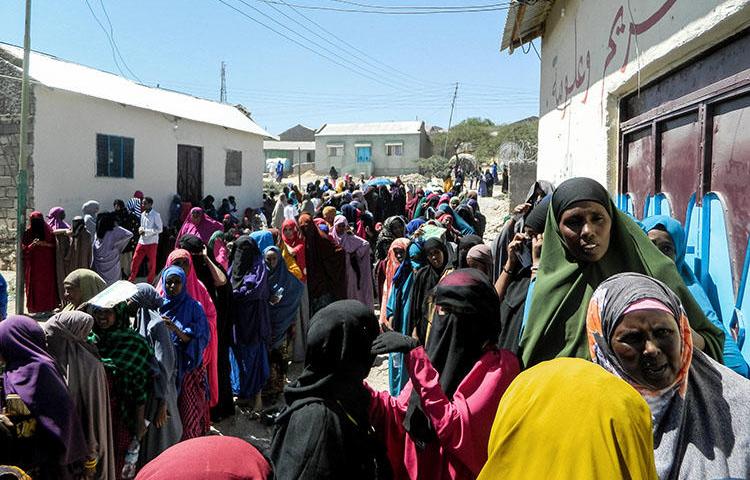People wait in a line to cast their votes in the presidential election at a polling station in Hargeisa, Somaliland, on November 13, 2017. Somaliland authorities in late May 2018 detained two journalists and banned two TV stations. (AFP)
