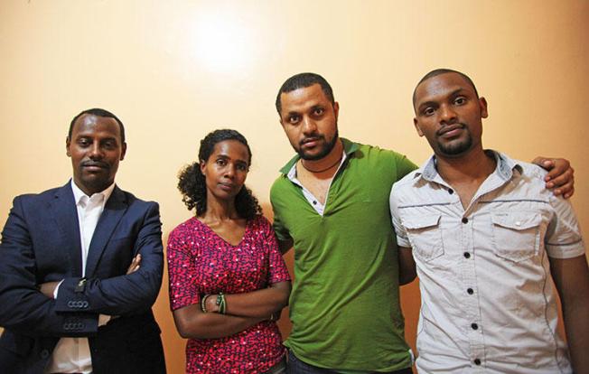 Ethiopian photojournalist Aziza Mohamed, pictured in Nairobi in 2014 with her colleagues, from left, Endalkachew Tesfaye and Endale Teshi, who both now live in the U.S. and Habtamu Seyoum, who is still waiting for resettlement. (CPJ/Nicole Schilit)