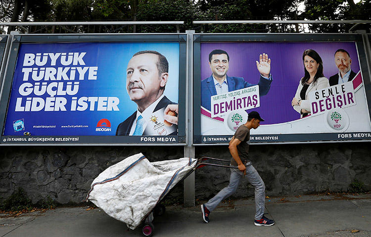 Election posters for President Recep Tayyip Erdoğan, left, and Turkey's main pro-Kurdish Peoples' Democratic Party, in Istanbul in June. CPJ joins other organizations in calling on presidential candidates to address press freedom issues. (Reuters/Huseyin Aldemir)