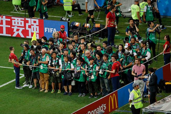 Press photographers at a 2018 World Cup match in Rostov-on-Don, Russia, on July 2. At least four female sports journalists were grabbed or sexually harassed while covering the soccer tournament. (AP/Hassan Ammar)