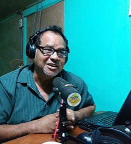 Broadcast journalist Leo Cárcamo hosts a show from Radio Darío's temporary studio. (Shannon O'Reilly)