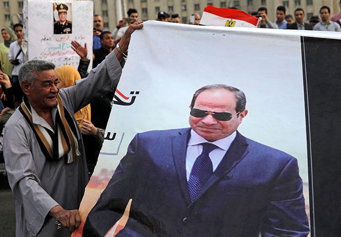 Supporters of Egyptian President Abdel Fattah el-Sisi in Tahrir square in April 2018 after the results of the country's recent presidential elections were announced. The country's authorities have continued to clampdown on the press using false news charges after the elections, according to reports. (Reuters/ Mohamed Abd El Ghany)