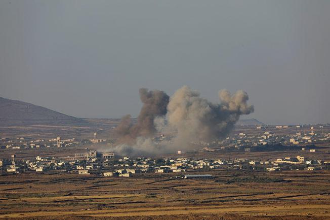 Smoke rises from the Quneitra area in southwestern Syria on July 16, 2018. Sama TV reporter Mustafa Salamah was covering the Syrian army's attempt to retake the area when he was fatally injured by a shell, according to reports. (Reuters/ Alaa al Faqir)
