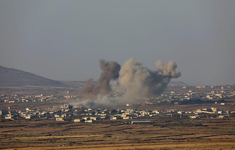 Smoke rises from the Quneitra area in southwestern Syria on July 16, 2018. Sama TV reporter Mustafa Salamah was covering the Syrian army's attempt to retake the area when he was fatally injured by a shell, according to reports. (Reuters/ Alaa al Faqir)
