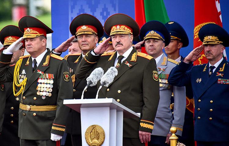 Belarusian President Alexander Lukashenko salutes during a military parade in Minsk, Belarus, on July 3, 2018. Journalist Dzmitry Halko was scheduled to go on trial July 10 in Minsk. (Sergei Gapon/Pool via Reuters)