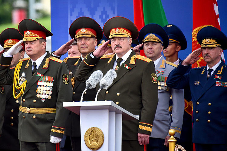 Belarusian President Alexander Lukashenko salutes during a military parade in Minsk, Belarus, on July 3, 2018. Journalist Dzmitry Halko was scheduled to go on trial July 10 in Minsk. (Sergei Gapon/Pool via Reuters)