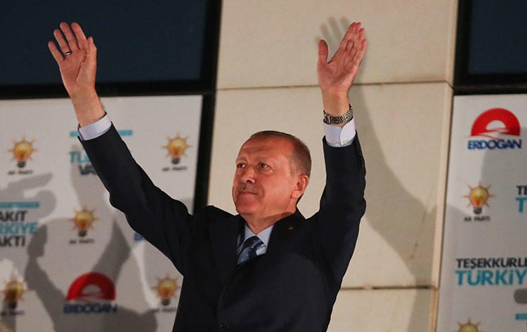 Turkish President Recep Tayyip Erdogan greets supporters in Ankara, Turkey, on June 25, 2018. A Turkish court handed heavy sentences to six journalists on July 6. (Reuters/Umit Bektas)