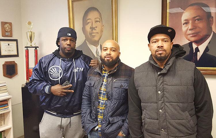 Zack Stoner, left, pictured with two members of Good Brothers, a community group he was part of. Stoner was shot dead in Chicago in May. (Charles Preston)