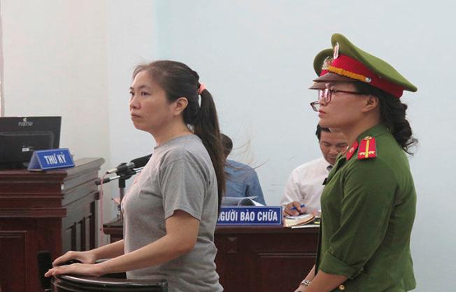 Prominent blogger Nguyen Ngoc Nhu Quynh, left, stands trial in Vietnam, on June 29, 2017. She was convicted on charges of distributing propoganda against the state, according to reports. (Vietnam News Agency/AP)