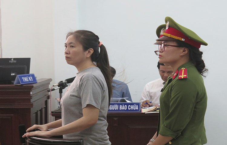 Prominent blogger Nguyen Ngoc Nhu Quynh, left, stands trial in Vietnam, on June 29, 2017. She was convicted on charges of distributing propoganda against the state, according to reports. (Vietnam News Agency/AP)