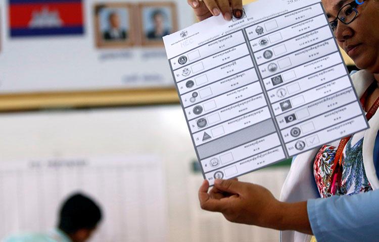 An official on July 29 counts ballots at a polling station in Phom Penh after polls have closed in Cambodia's general election. Cambodia's government blocked news websites ahead of the national election, according to reports. (Reuters/Samrang Pring)