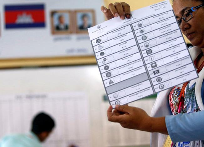An official on July 29 counts ballots at a polling station in Phom Penh after polls have closed in Cambodia's general election. Cambodia's government blocked news websites ahead of the national election, according to reports. (Reuters/Samrang Pring)