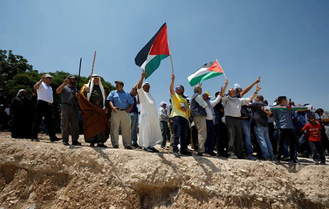 Palestinians protest against Israel's plans to demolish the Bedouin village of Khan al-Ahmar, in the occupied West Bank, on July 13, 2018. Israeli forces arrested and detained a Palestine TV reporter in the West Bank on August 15. (Reuters/Mohamad Torokman)
