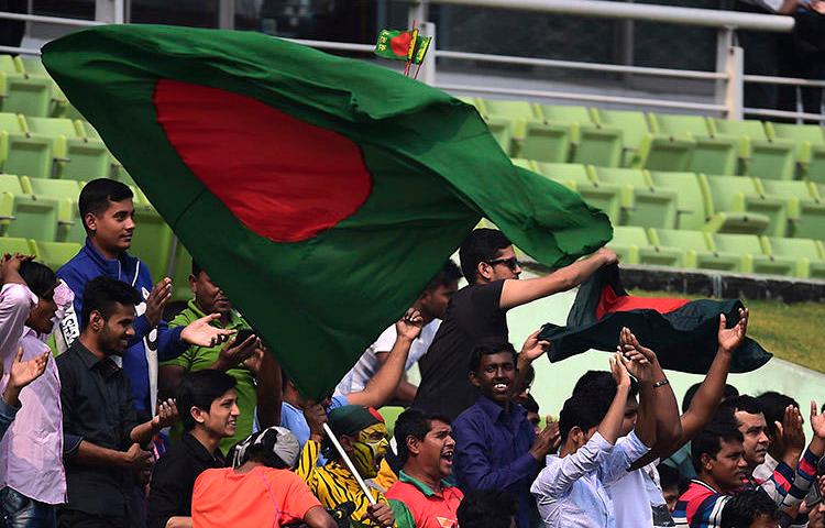 The Bangladesh flag is waved during a cricket match in Dhaka in early 2018. At least four journalists were attacked in Bangladesh while covering local elections in July. (AFP/Munir Uz Zaman)