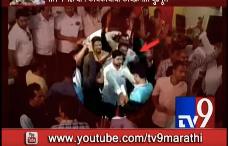 A screenshot from TV9 Marathi's YouTube channel shows members of a crowd attacking the broadcaster's staff.