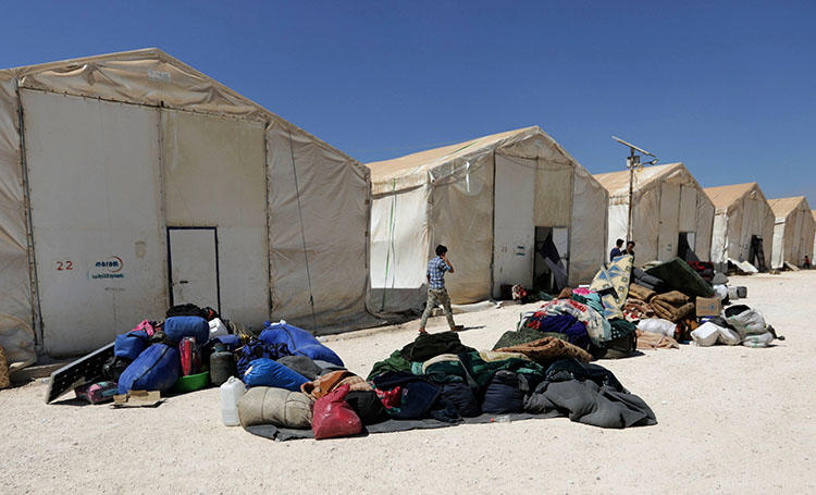 People internally displaced from Deraa province at a temporary camp in the Aleppo province in Syria on July 23, 2018. Civilians including at least 60 journalists fled the southern provinces of Daraa and Quneitra for northern Syria to escape advancing government-aligned forces. (Reuters/Khalil Ashawi)
