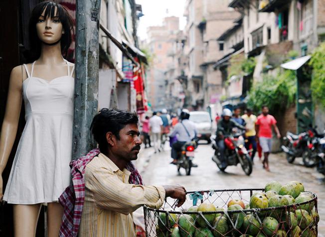 A street vendor waits for customers in Kathmandu, Nepal, on July 18, 2018. A new criminal code came into effect on August 17 in Nepal that threatened press freedom. (Reuters/Navesh Chitrakar)