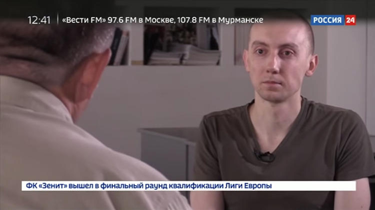 A screen shot taken on August 22, 2018, from the YouTube channel of Russian state-run TV channel Rossiya 24, of an August 17 broadcast of a false confession by Stanislav Aseyev, a Ukrainian reporter held for more than a year by Russia-backed separatists in Donetsk, in eastern Ukraine. (YouTube/Rossiya 24)
