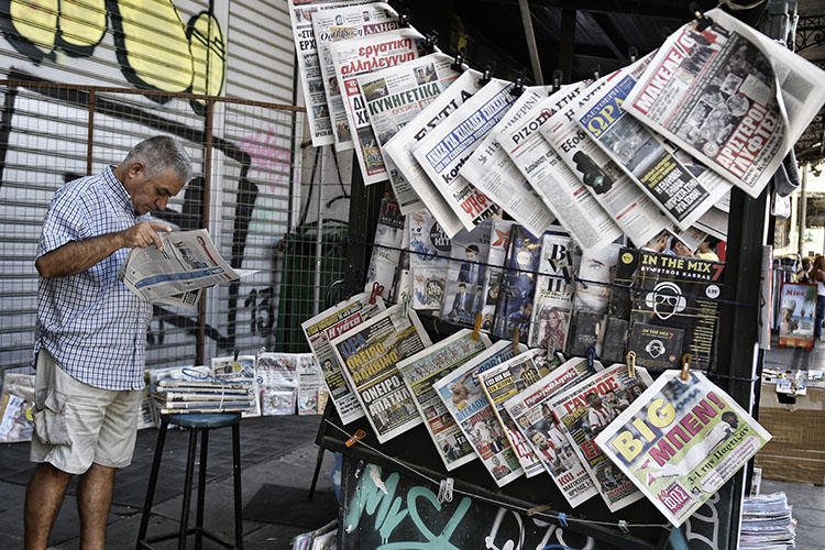 A newspaper stand in Athens, in July 2017. Police detained three journalists at the daily paper Fileleftheros, after a politician filed a defamation complaint. (AFP/Louisa Gouliamaki)