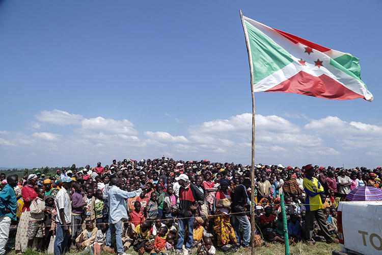 Residents gather for a ceremony in Bugendana in June 2018 to mark the adoption of Burundi's new constitution. Three radio journalists covering a land dispute in the country's capital in August 2018 say police harassed and attacked them. (STR/AFP)