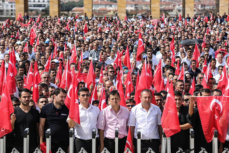People hold Turkish flags during a ceremony marking the 96th anniversary of Victory Day, commemorating a decisive battle in the Turkish War of Independence, in Ankara on August 30, 2018. (AFP/Adem Altan)