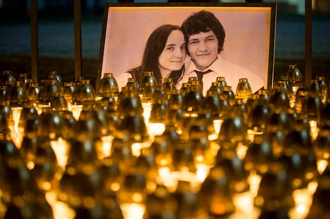 A memorial for investigative reporter Ján Kuciak and his fiancée, Martina Kušnírová, is held in Bratislava in February. Slovak police in September charged three people with the couple's murder. (AP/Bundas Engler/file)