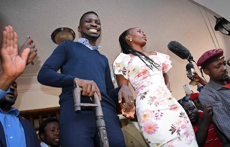 Opposition MP Kyagulanyi Ssentamu, known as Bobi Wine, and his wife Barbara Itungo Kyagulanyi, pictured at their home in Kampala, on September 20. Police detained at least eight journalists who were covering Bobi Wine's return to Uganda from the U.S. (AP/Ronald Kabuubi)