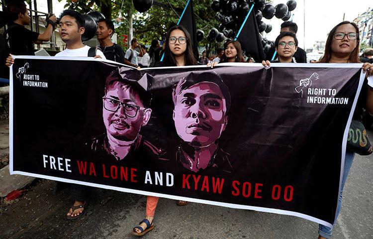 People march to show solidarity for jailed Reuters journalists Wa Lone and Kyaw Soe Oo in Yangon, Myanmar, on September 1, 2018, two days before a local court sentenced them to 7 years in prison on charges of breaching the country's Official Secrets Act. (Reuters/Ann Wang)