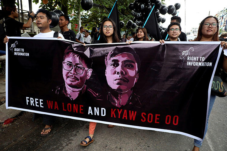 People march to show solidarity for jailed Reuters journalists Wa Lone and Kyaw Soe Oo in Yangon, Myanmar, on September 1, 2018, two days before a local court sentenced them to 7 years in prison on charges of breaching the country's Official Secrets Act. (Reuters/Ann Wang)