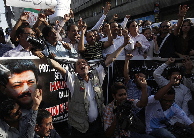 Pakistani journalists protest over the attack that nearly killed Geo News anchor Hamid Mir in April 2014. Several independent organizations are advocating for journalist safety. (Reuters/Akhtar Soomro)