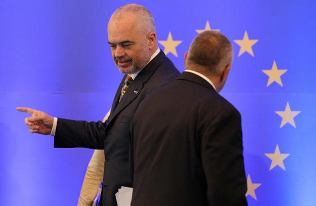 Bulgarian Prime Minister Boyko Borissov stands by the EU flag at a conference in Sofia, in December 2017. Police in Bulgaria briefly detained two journalists investigating allegations of fraud involving EU funds. (Reuters/Stoyan Nenov)