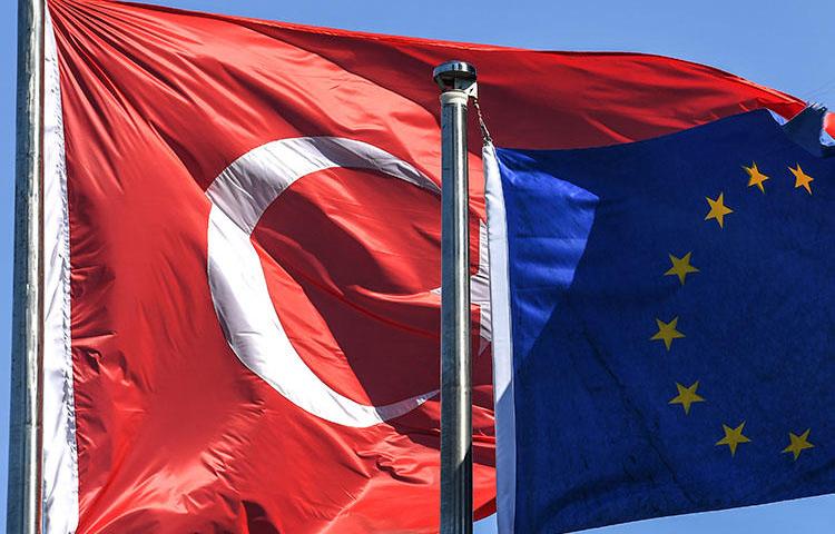 Turkish and European Union flags pictured in Istanbul's financial and business district in August. Turkey continues its crackdown on press freedom, with more journalists detained and questioned over their reporting this week. (AFP/Ozan Kose)